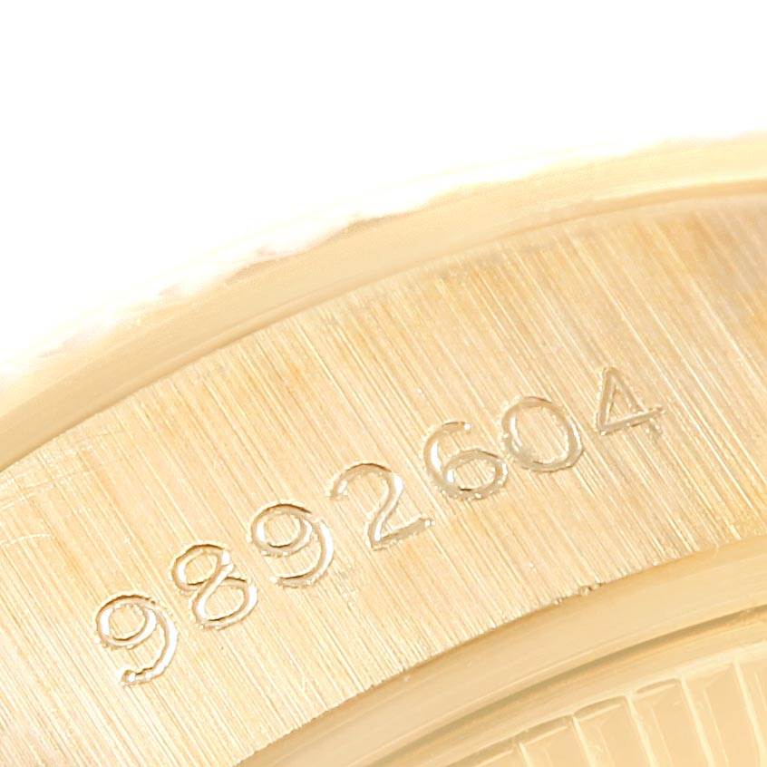 This close-up image shows a partial serial number engraving on the bezel of a Rolex President 69178 Women
s Yellow Gold Champagne Dial 69178 Women
s Yellow Gold Champagne Dial model watch.