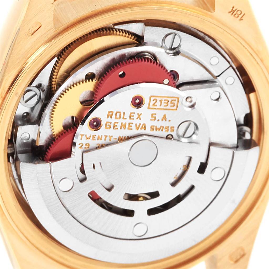 Close-up of the Rolex President 69178 Women
s Yellow Gold Champagne Dial 69178 Women
s Yellow Gold Champagne Dial model showing the intricate mechanical movement and gears from the back.