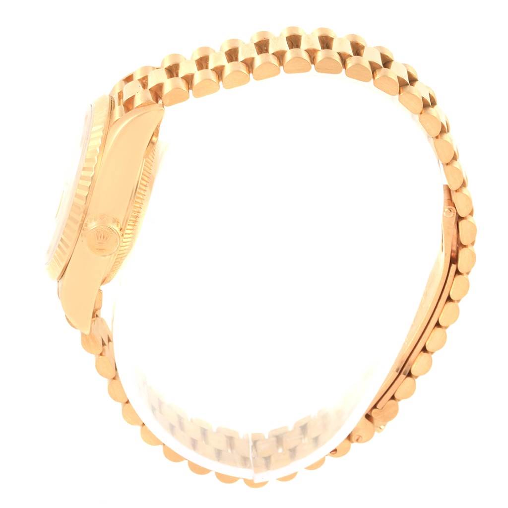 The image shows a side angle of the Rolex President 69178 Women
s Yellow Gold Champagne Dial 69178 Women
s Yellow Gold Champagne Dial model, focusing on the gold bracelet and watch case profile.