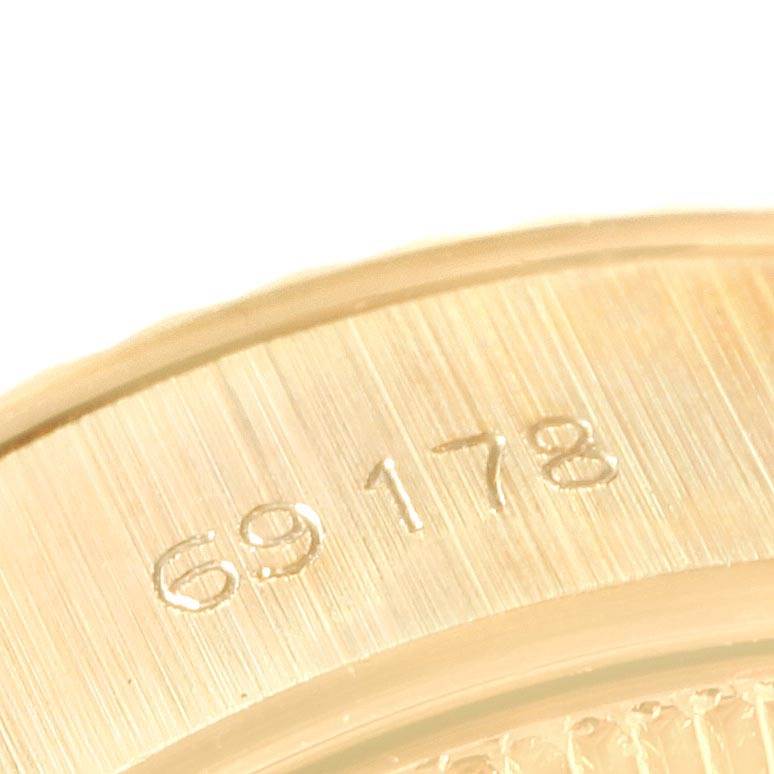 This image shows a close-up angle of the engraved reference number on the case of a Rolex President 69178 Women
s Yellow Gold Champagne Dial 69178 Women
s Yellow Gold Champagne Dial model watch.