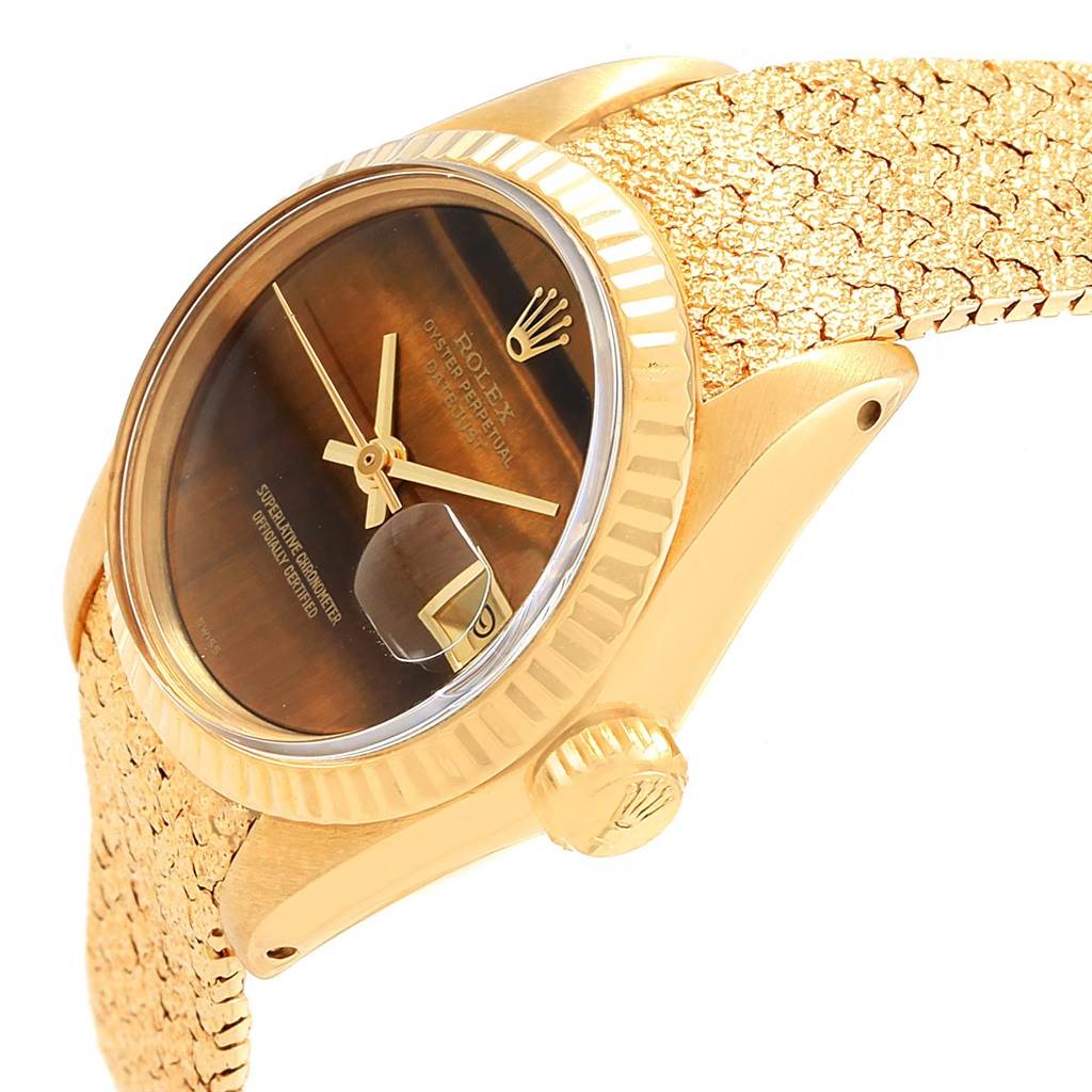 This angle shows the Rolex President 6917 Women's Yellow Gold Brown Dial 6917 Women's Yellow Gold Brown Dial model watch from a side perspective, highlighting the dial, bezel, crown, and textured wristband.