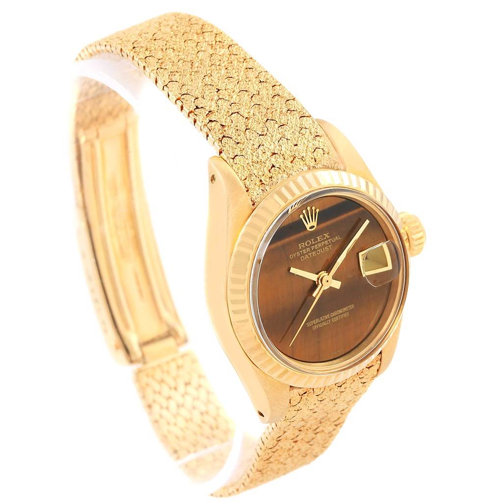 The image shows a side angle of the Rolex President 6917 Women's Yellow Gold Brown Dial 6917 Women's Yellow Gold Brown Dial model watch, featuring its dial, bezel, crown, and band.