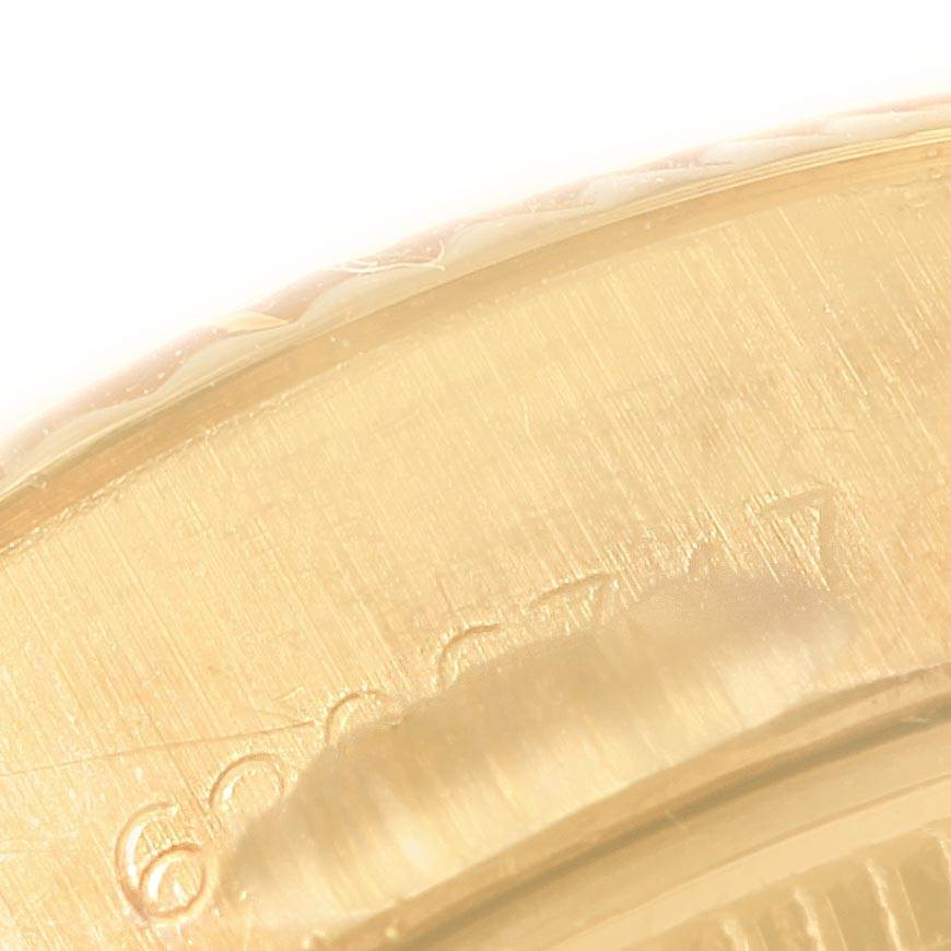 This image shows a close-up of the edge and part of the case back of the Rolex President 6917 Women's Yellow Gold Brown Dial 6917 Women's Yellow Gold Brown Dial model watch. 