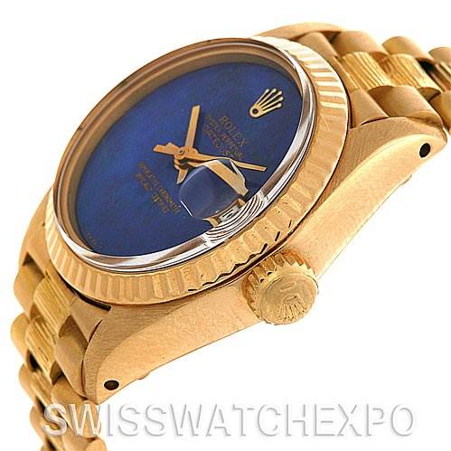 This image shows a close-up of the Rolex President 6917 Women's Yellow Gold Blue Dial 6917 Women's Yellow Gold Blue Dial model watch, focusing on the side angle with the dial, bezel, and crown visible.