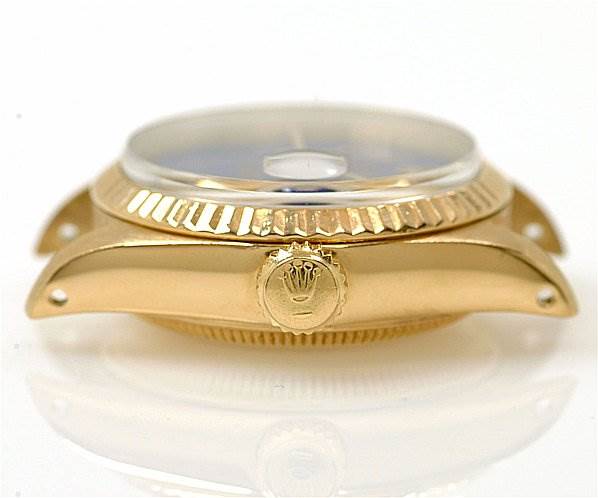 This image shows a close-up side view of the case, bezel, and crystal of a Rolex President 6917 Women's Yellow Gold Blue Dial 6917 Women's Yellow Gold Blue Dial model watch.