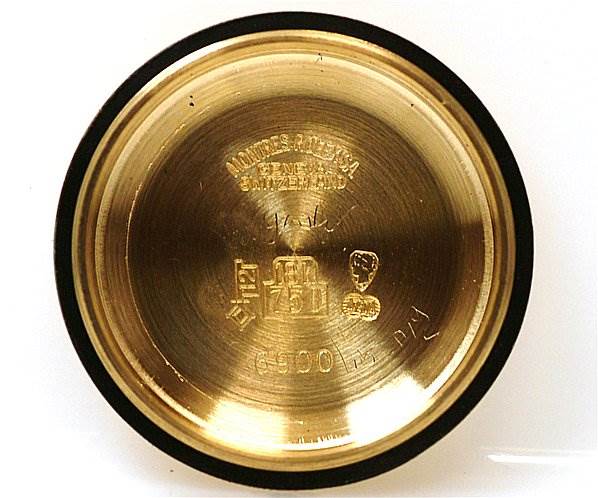 The image shows the inner side of the case back of a Rolex President 6917 Women's Yellow Gold Blue Dial 6917 Women's Yellow Gold Blue Dial model watch, with markings and engravings visible.