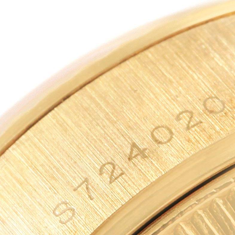 This close-up image shows the serial number engraving on the side of a Rolex President 69178 Women
s Yellow Gold Champagne Dial 69178 Women
s Yellow Gold Champagne Dial model watch.