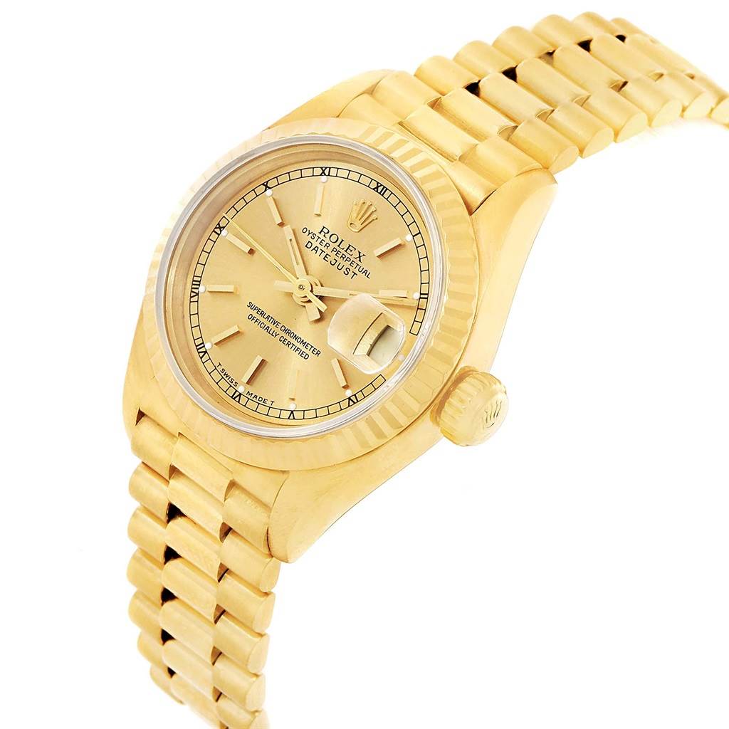 This image shows a gold Rolex President 69178 Women
s Yellow Gold Champagne Dial 69178 Women
s Yellow Gold Champagne Dial model Datejust watch at an angled side view, highlighting the dial, bezel, crown, and bracelet.