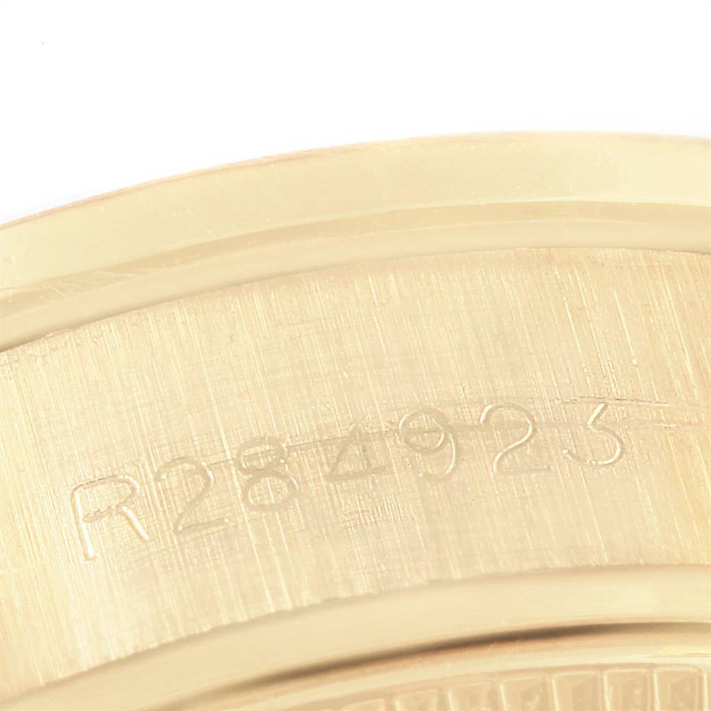 This image shows a close-up view of the case back edge with engravings on a Rolex President 69138 Women
s Yellow Gold Black Dial 69138 Women
s Yellow Gold Black Dial model watch.