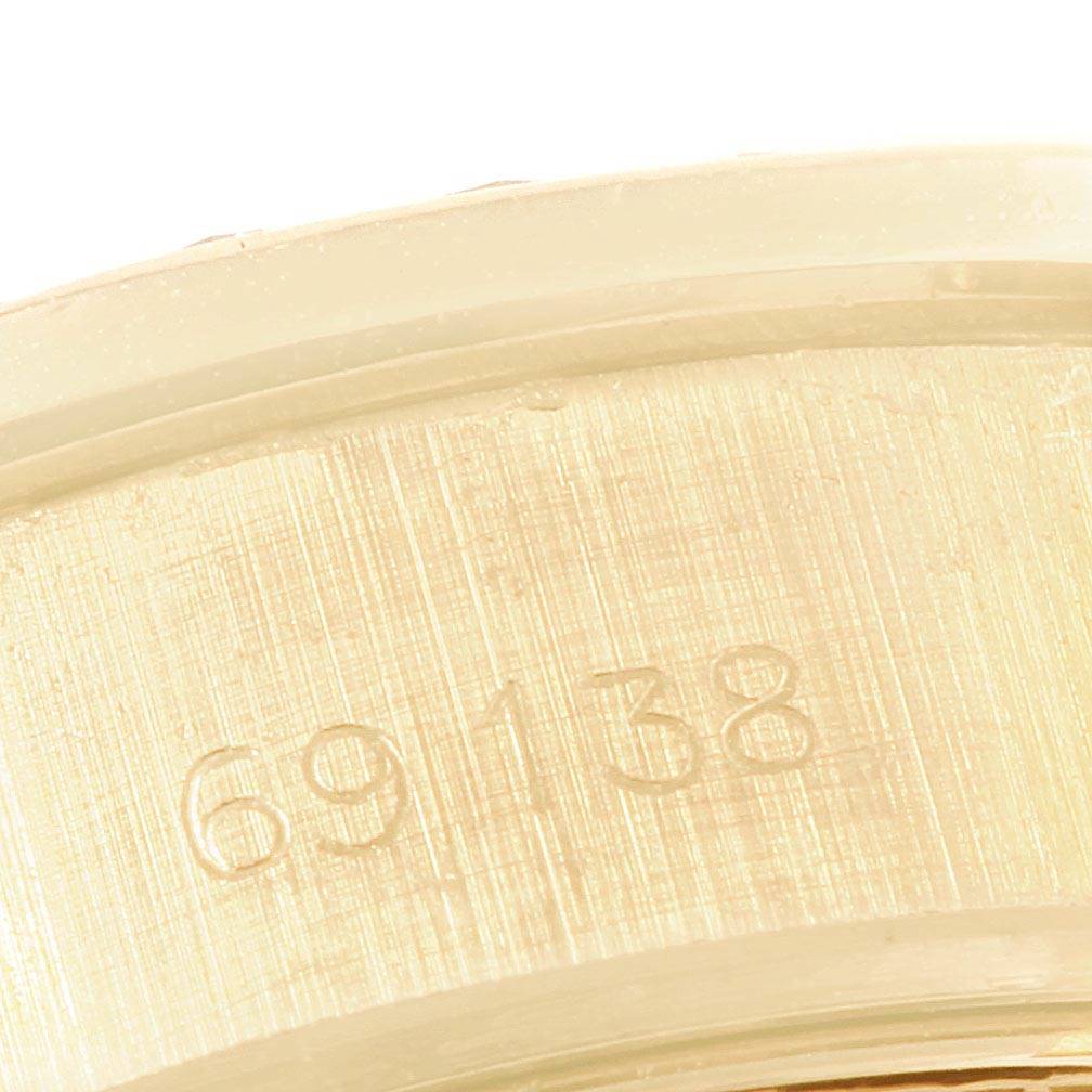 This image shows a close-up of the caseback
s inner surface with model number 69138 engraved, from the Rolex President 69138 Women
s Yellow Gold Black Dial 69138 Women
s Yellow Gold Black Dial watch.