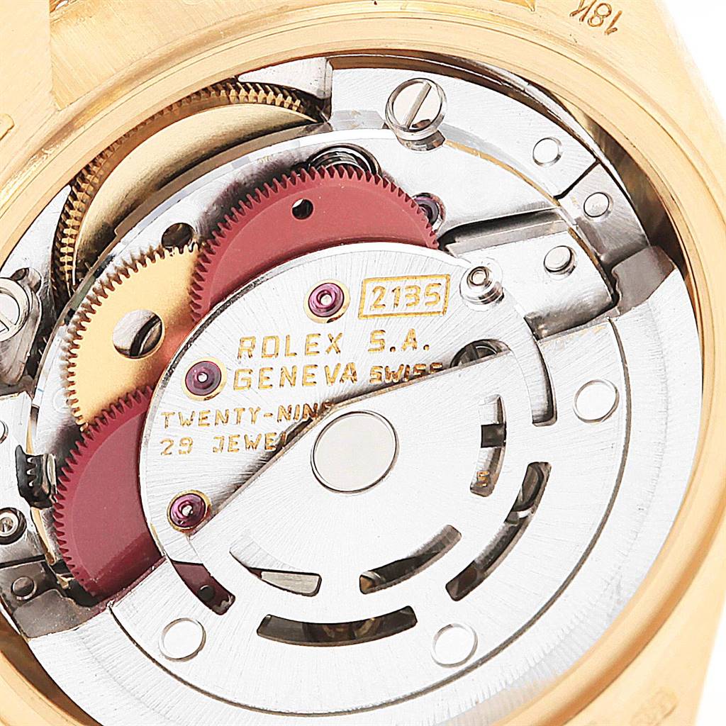 This image shows a close-up of the internal mechanism of a Rolex President 69138 Women
s Yellow Gold Black Dial 69138 Women
s Yellow Gold Black Dial model, focusing on its movement parts.