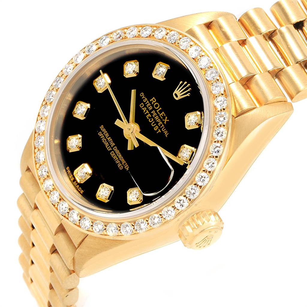 This Rolex President 69138 Women
s Yellow Gold Black Dial 69138 Women
s Yellow Gold Black Dial watch is shown at an oblique angle, highlighting the gold case, diamond bezel, black dial, and bracelet.