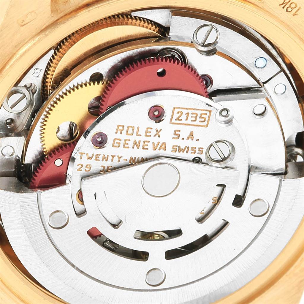 This image shows the intricate inner mechanisms of a Rolex President 69178 Women's Yellow Gold Orange Dial 69178 Women's Yellow Gold Orange Dial model watch, focusing on the movement components.