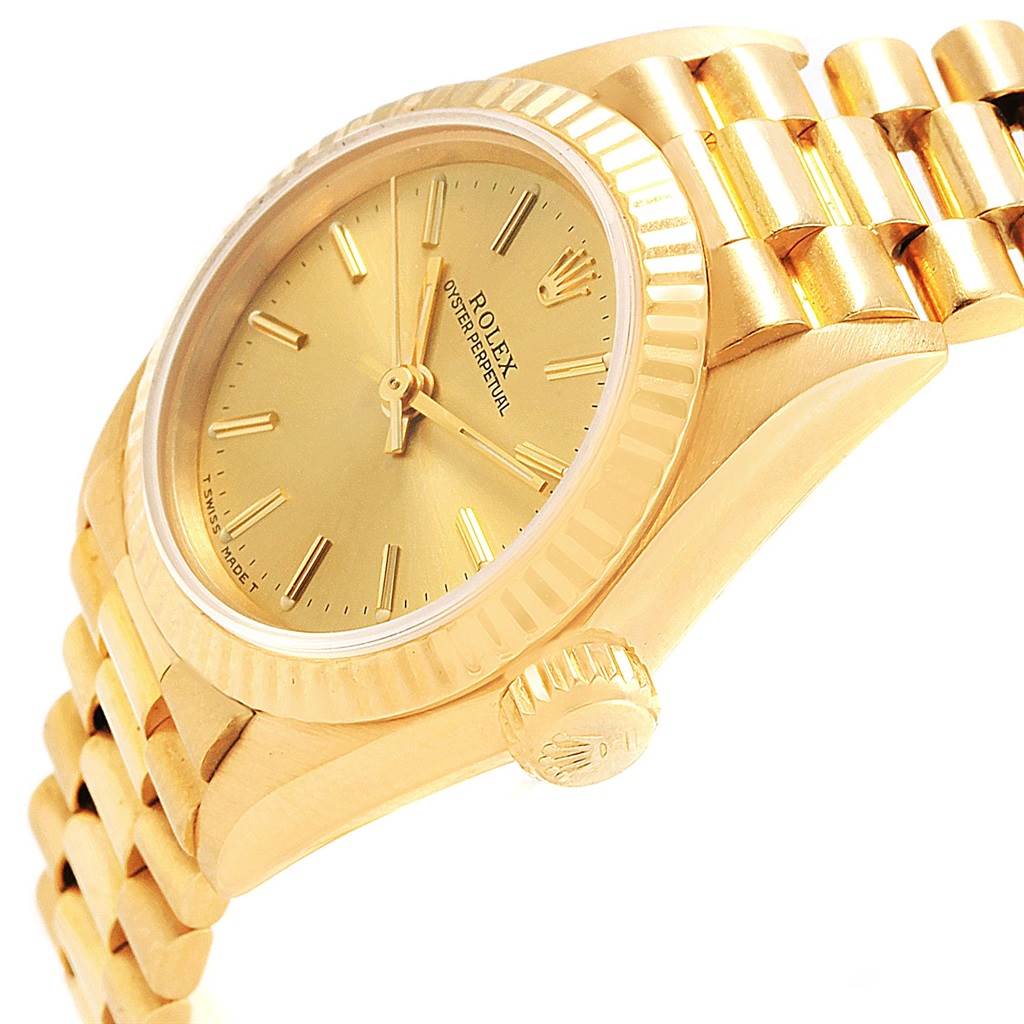 The image shows a side angle of the Rolex President 67198 Women
s Yellow Gold Champagne Dial 67198 Women
s Yellow Gold Champagne Dial model watch, highlighting the crown, bezel, and part of the bracelet.