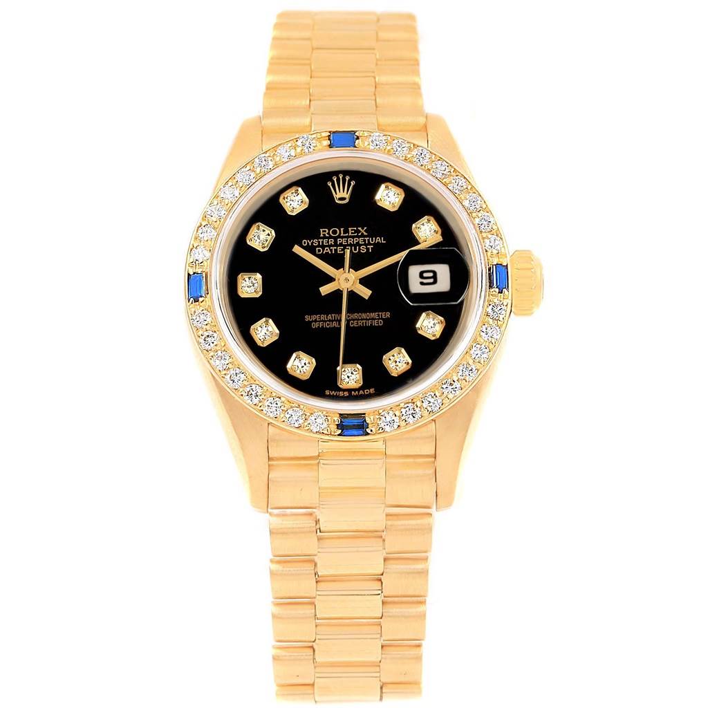 The image shows a front view of a Rolex President 79088 Women's Yellow Gold Black Dial 79088 Women's Yellow Gold Black Dial model watch with a gold band and a diamond-studded bezel.