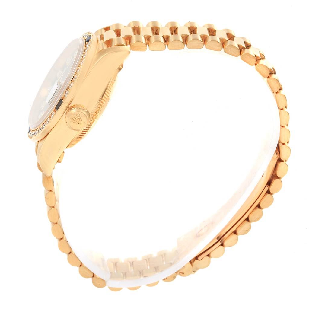 The image shows a side view of a Rolex President 79088 Women's Yellow Gold Black Dial 79088 Women's Yellow Gold Black Dial model watch, focusing on the gold bracelet and crown.