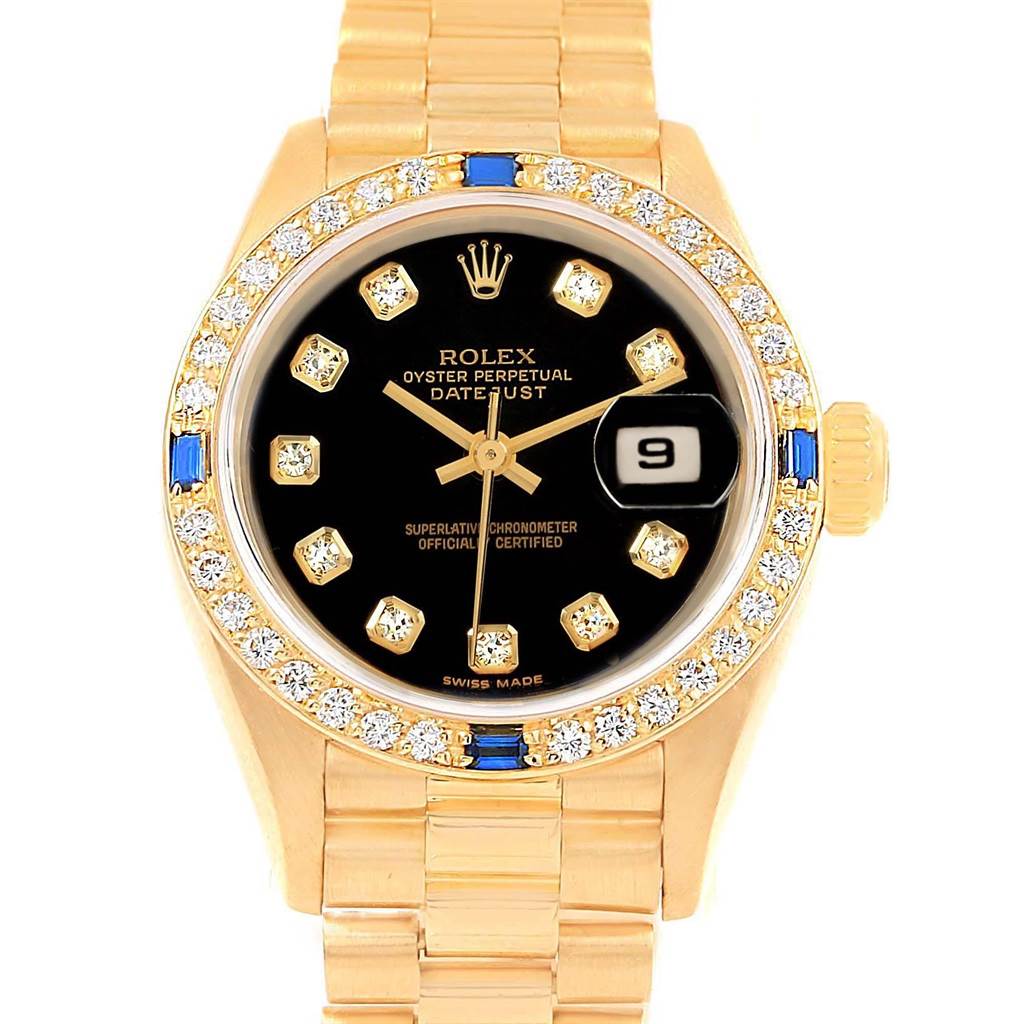 The image shows a Rolex President 79088 Women's Yellow Gold Black Dial 79088 Women's Yellow Gold Black Dial model watch from a frontal angle, highlighting the dial, bezel, and bracelet.