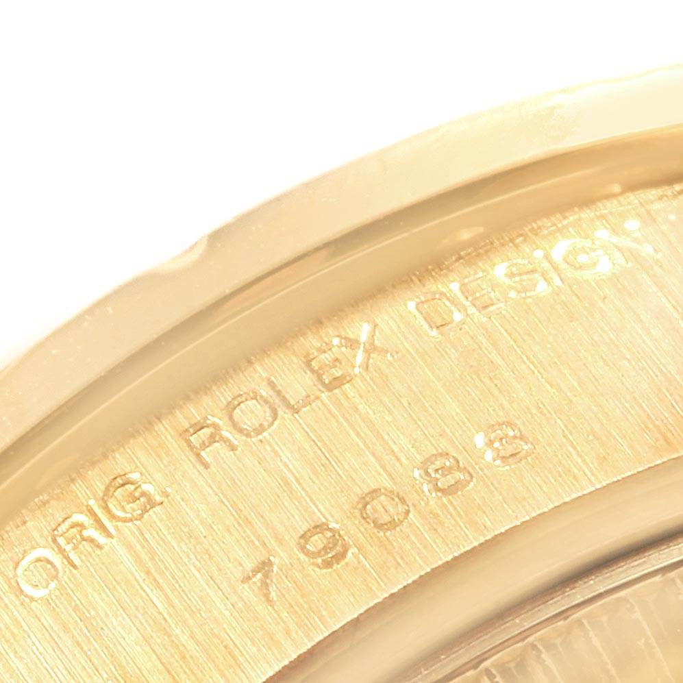 This close-up image shows the engraving of the Rolex design number on the case back rim of a Rolex President 79088 Women's Yellow Gold Black Dial 79088 Women's Yellow Gold Black Dial watch.