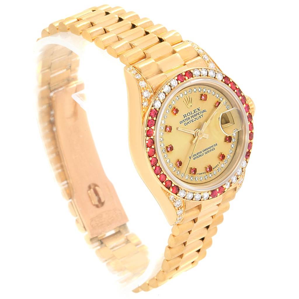 This image shows a side view of a Rolex President 69038 Women
s Yellow Gold Champagne Dial 69038 Women
s Yellow Gold Champagne Dial watch with a gold bracelet and a jeweled bezel and dial.