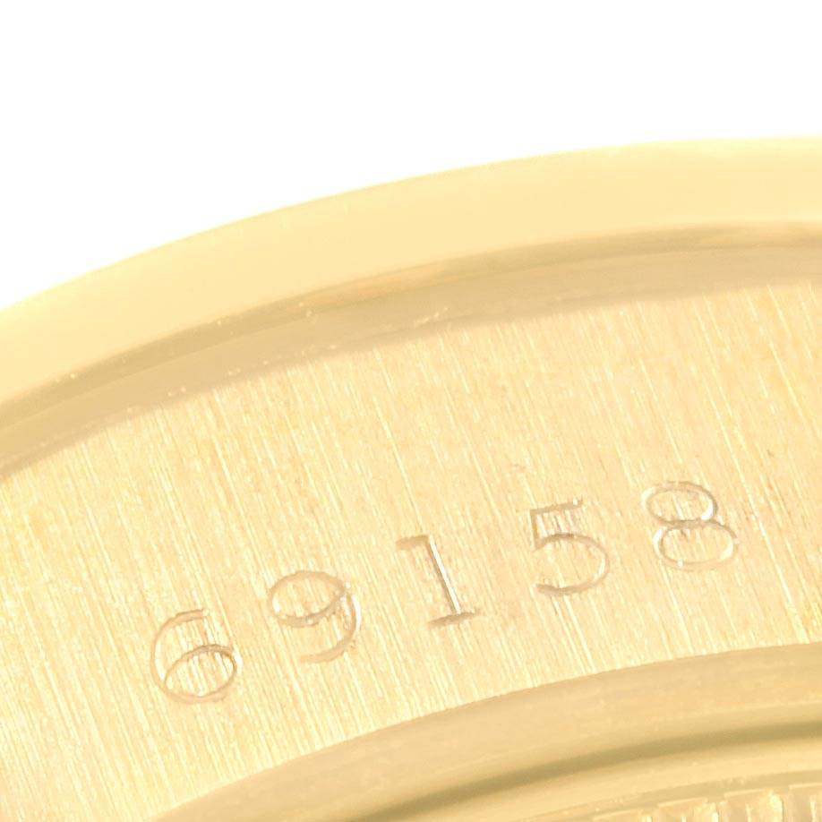 This image shows a close-up of the serial number "69158" engraved on the back case of a Rolex President 69158 Women
s Yellow Gold Silver Dial 69158 Women
s Yellow Gold Silver Dial model watch.