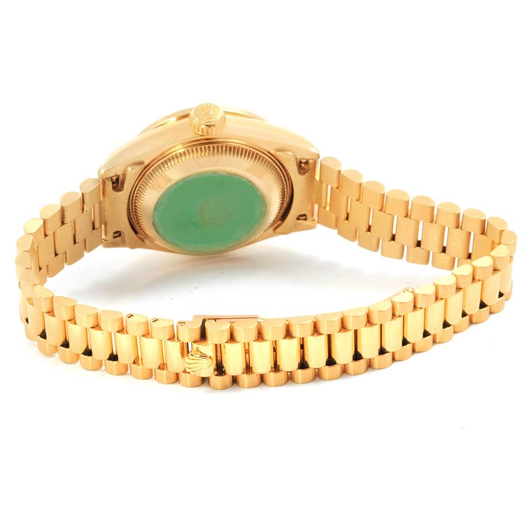 This image shows the back case and bracelet of a Rolex President 69158 Women
s Yellow Gold Silver Dial 69158 Women
s Yellow Gold Silver Dial model watch with a gold finish.