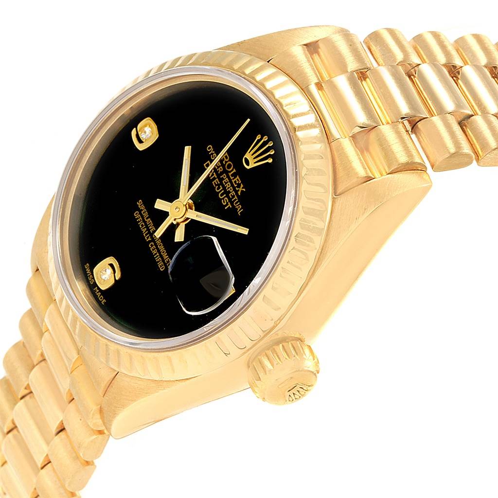 This image shows a close-up angled view of the Rolex President 69178 Women's Yellow Gold Black Dial 69178 Women's Yellow Gold Black Dial model watch, highlighting the dial, crown, and part of the bracelet.