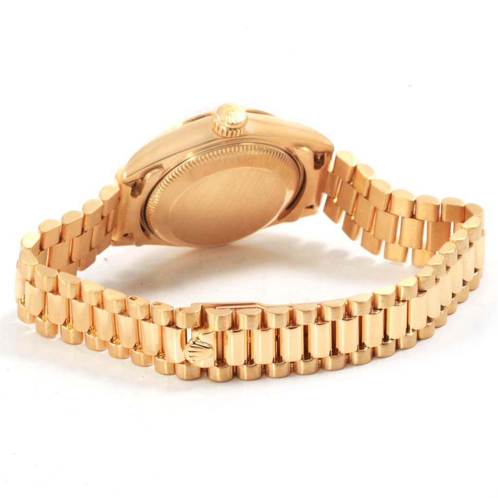 This image shows the back view of the Rolex President 69178 Women's Yellow Gold Black Dial 69178 Women's Yellow Gold Black Dial model watch, highlighting the case back, crown, and President bracelet.