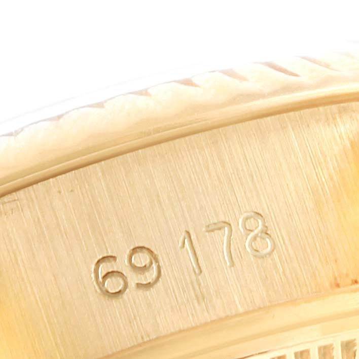 This close-up image shows the case and model number "69178" of a Rolex President 69178 Women's Yellow Gold Black Dial 69178 Women's Yellow Gold Black Dial watch.