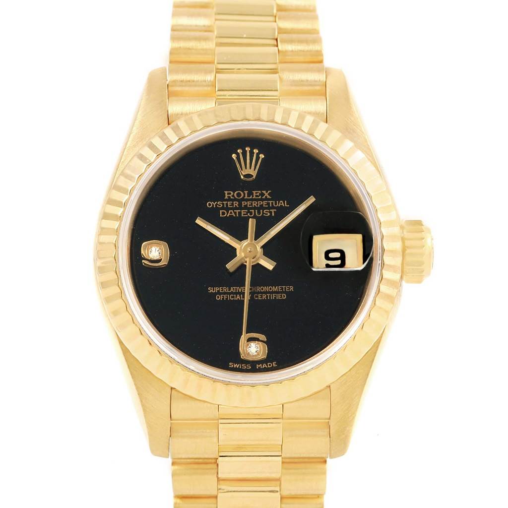 The image shows a frontal view of a Rolex President 69178 Women's Yellow Gold Black Dial 69178 Women's Yellow Gold Black Dial model watch, highlighting its black dial, date window, and gold bracelet.