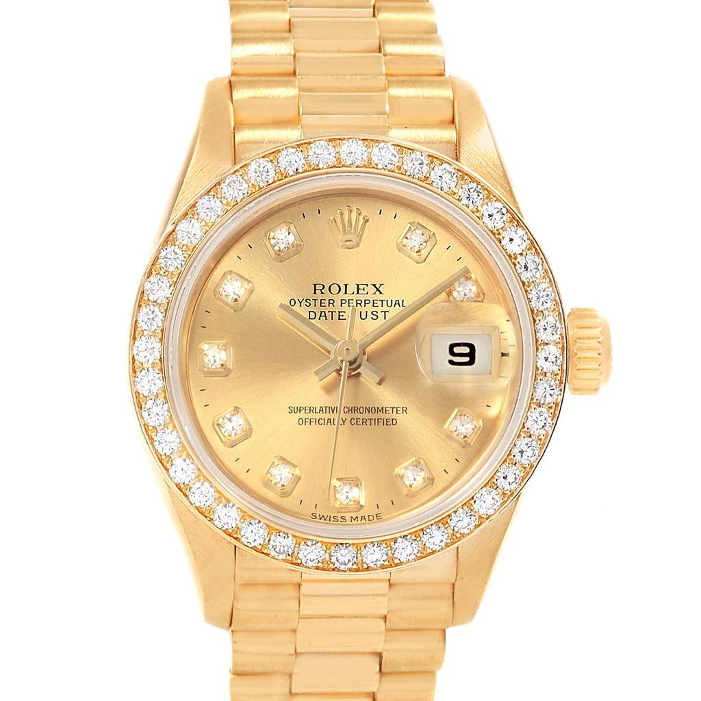 The image shows a front view of a gold Rolex President 79178 Women
s Yellow Gold Champagne Dial 79178 Women
s Yellow Gold Champagne Dial watch with diamond markers and a date display.