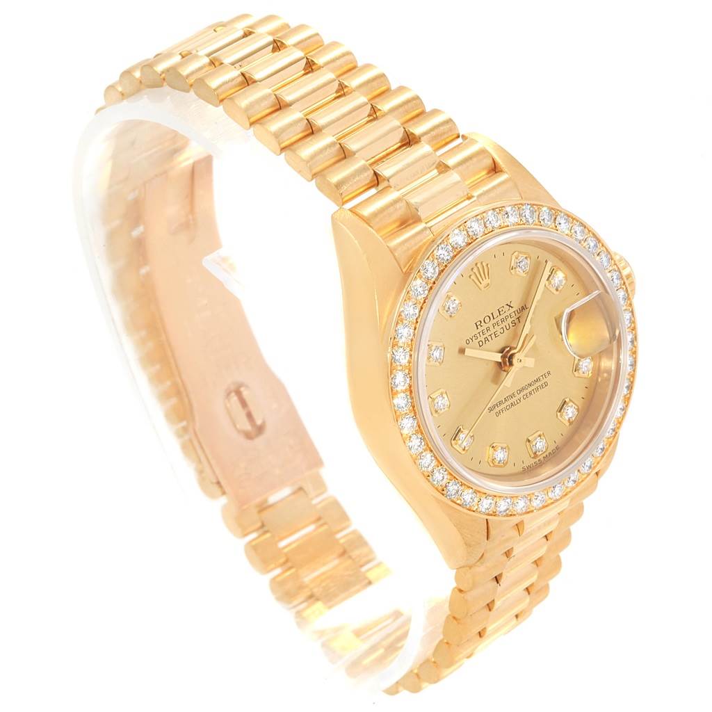 The image shows a Rolex President 79178 Women
s Yellow Gold Champagne Dial 79178 Women
s Yellow Gold Champagne Dial model watch from a diagonal top angle, highlighting its dial, bezel, and bracelet.