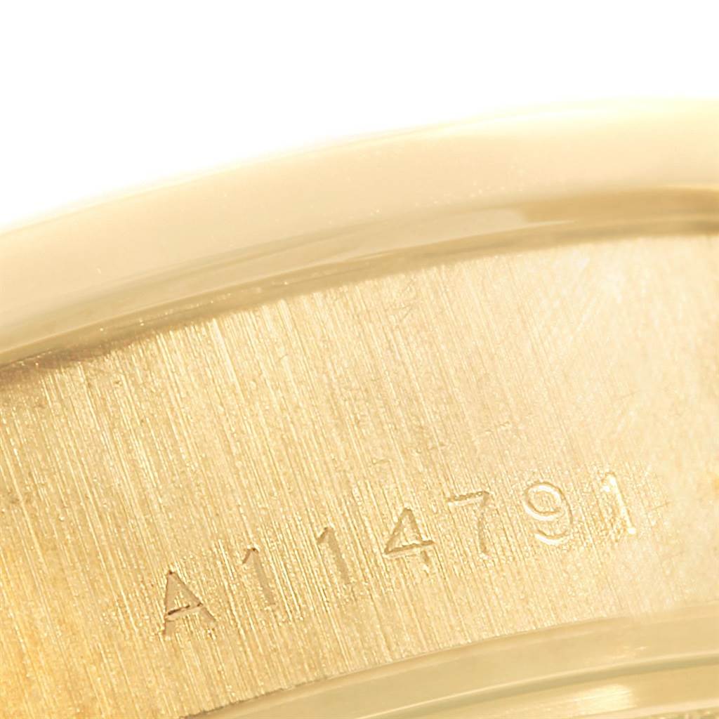 This close-up image shows the serial number on the metal caseback edge of a Rolex President 79178 Women
s Yellow Gold Champagne Dial 79178 Women
s Yellow Gold Champagne Dial model watch.