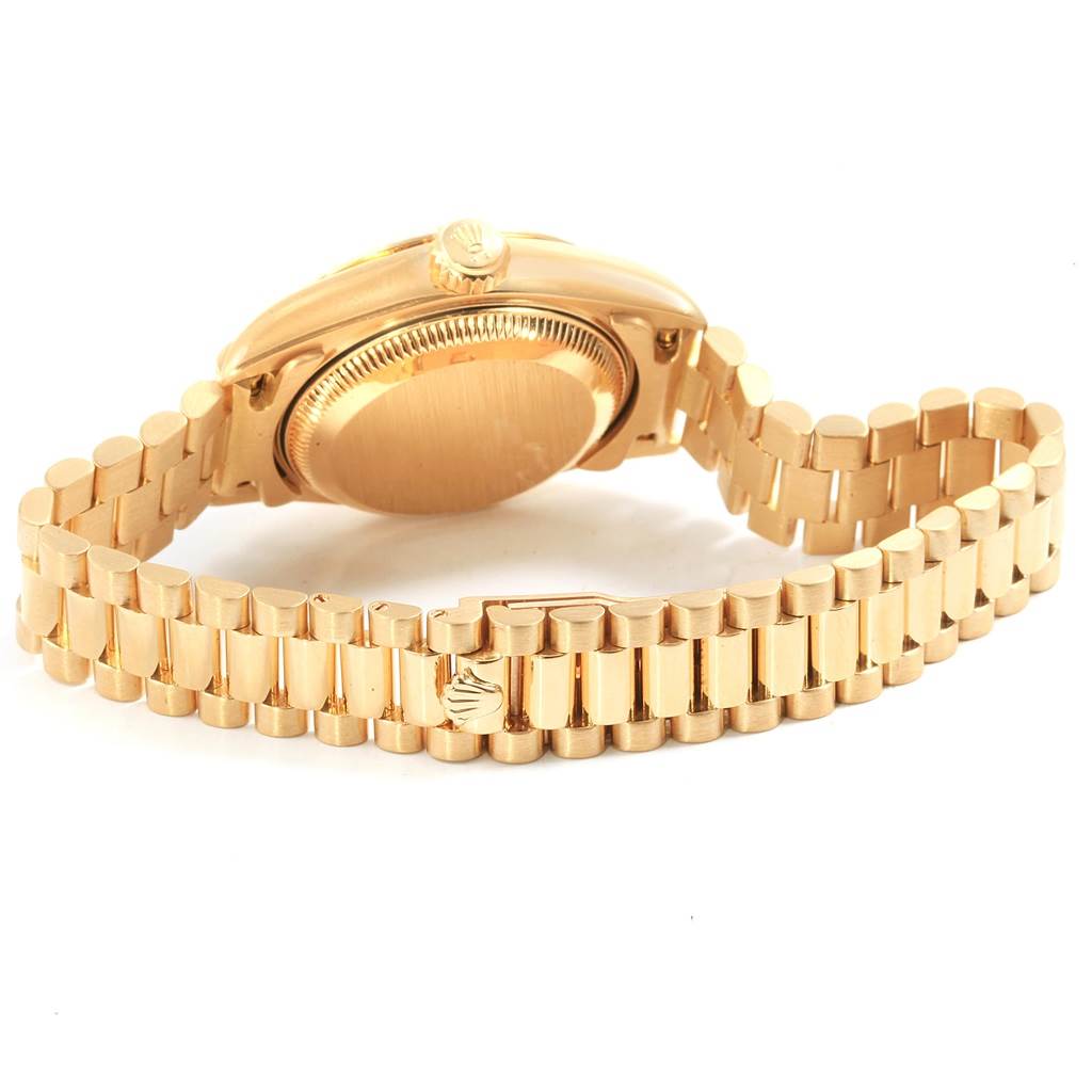 The image shows the back view of the Rolex President 79178 Women
s Yellow Gold Champagne Dial 79178 Women
s Yellow Gold Champagne Dial model watch, highlighting the case back and the bracelet with the clasp.