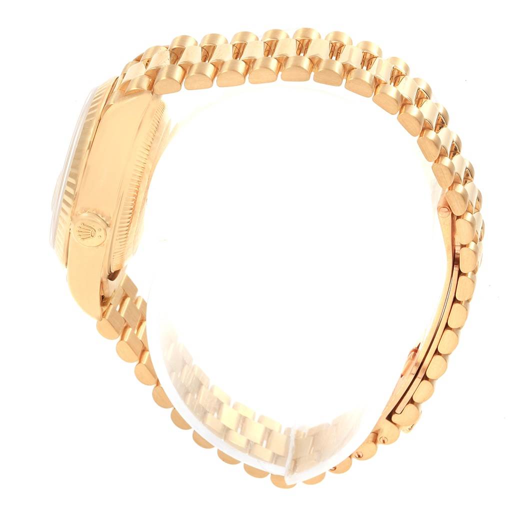 The image shows a side view of the Rolex President 79178 Women
s Yellow Gold Champagne Dial 79178 Women
s Yellow Gold Champagne Dial model, highlighting its gold case and bracelet.