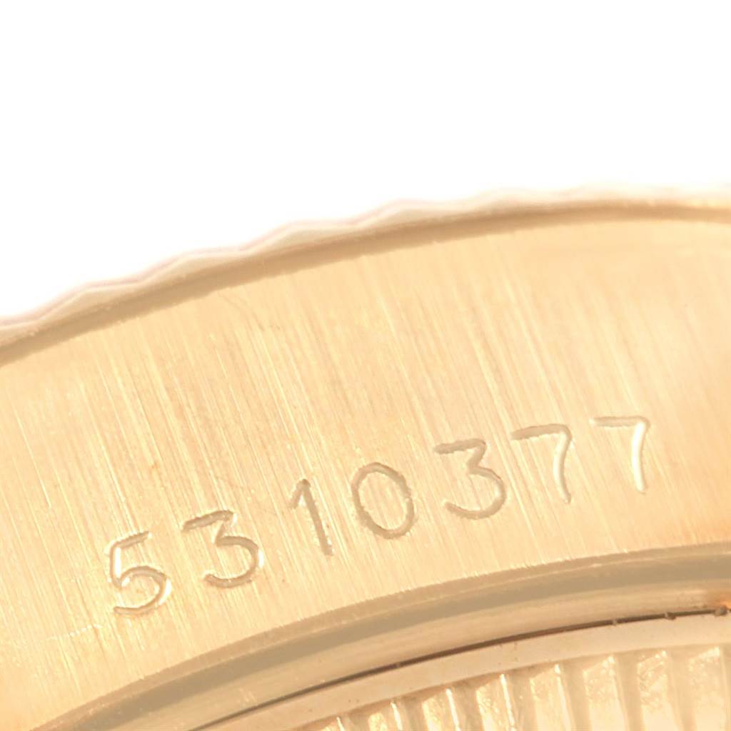 The image shows a close-up of the serial number etched on the case back of the Rolex President 6917 Women's Yellow Gold Champagne Dial 6917 Women's Yellow Gold Champagne Dial model watch.