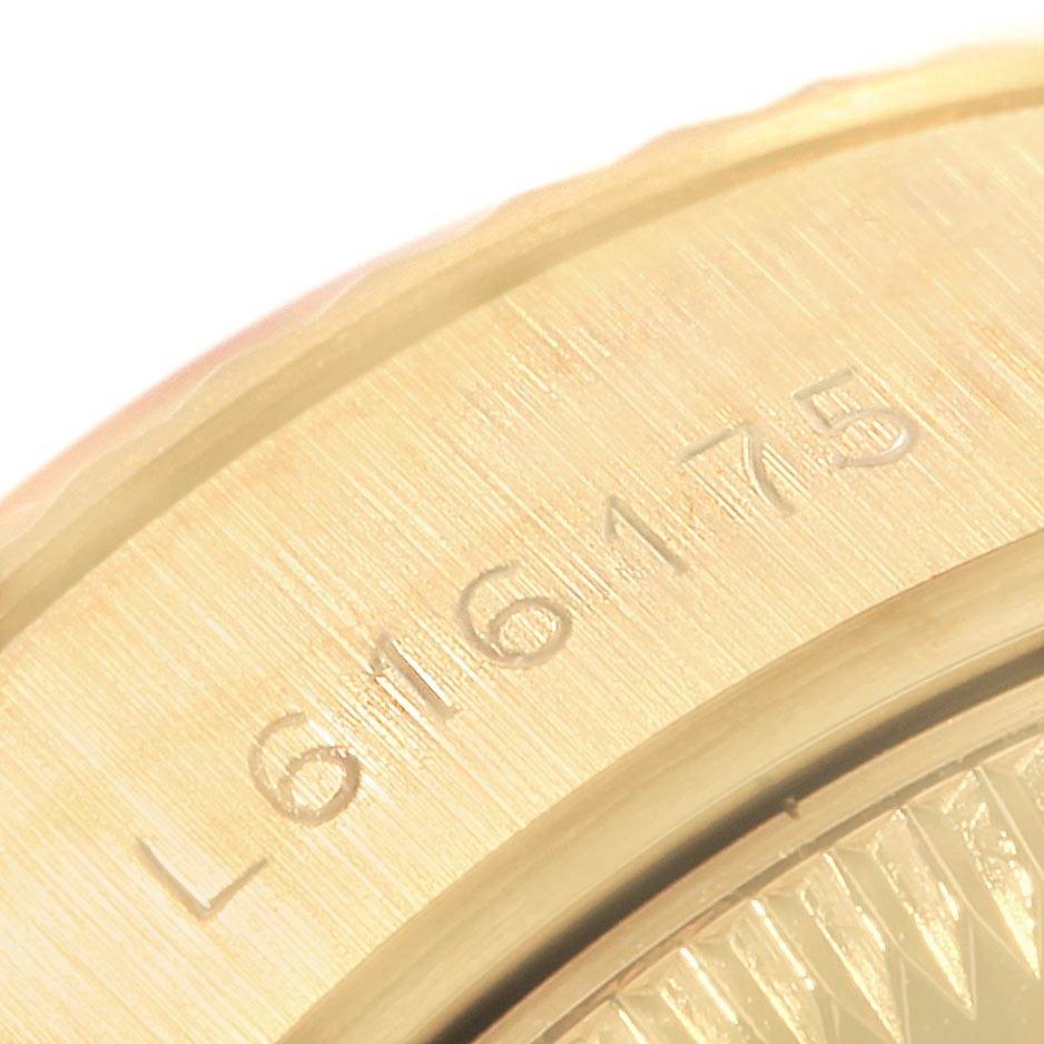The image shows a close-up of the bezel and serial number of a Rolex President 69178 Women
s Yellow Gold Champagne Dial 69178 Women
s Yellow Gold Champagne Dial model watch.