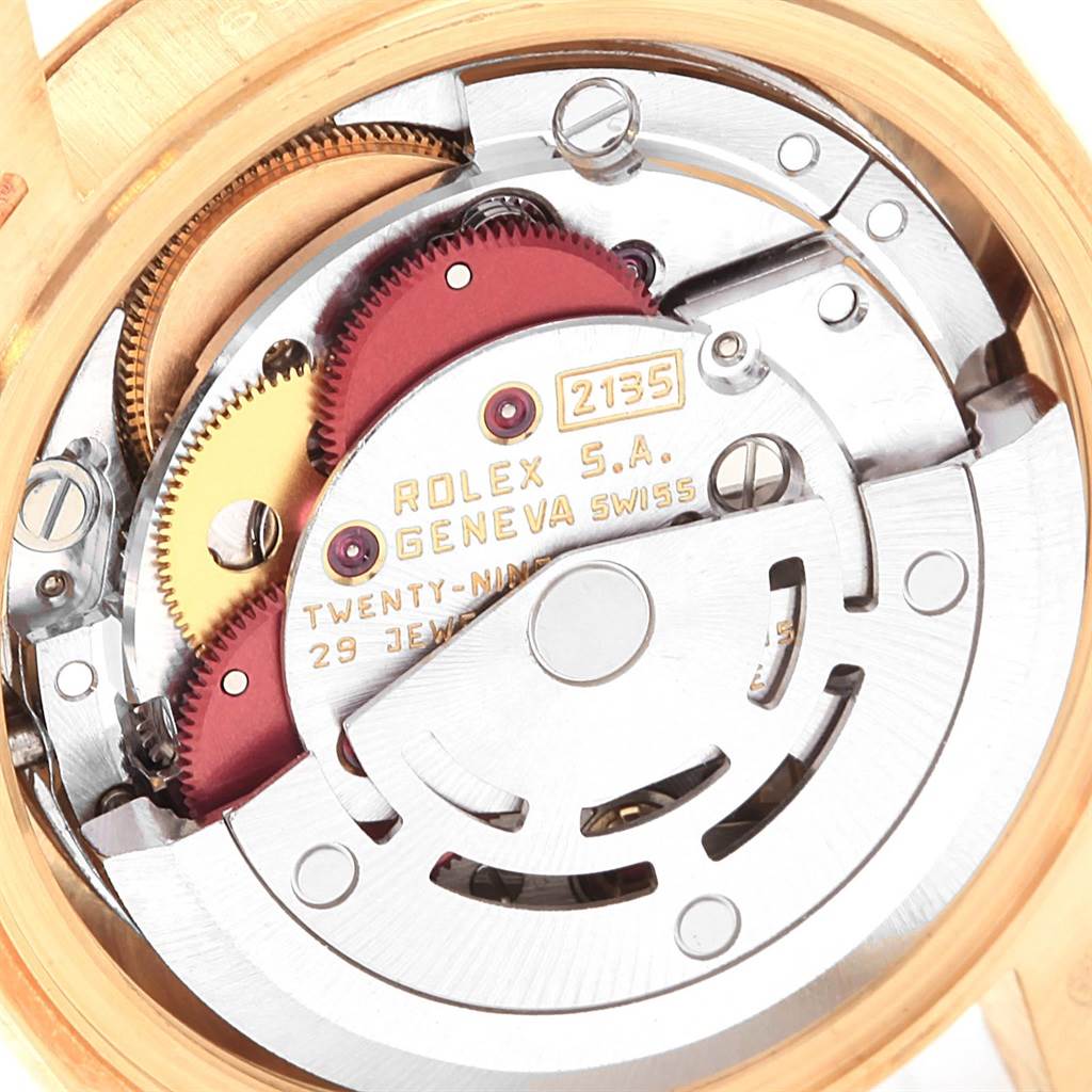 The image shows a close-up of the movement mechanism of a Rolex President 69178 Women
s Yellow Gold Champagne Dial 69178 Women
s Yellow Gold Champagne Dial model watch.