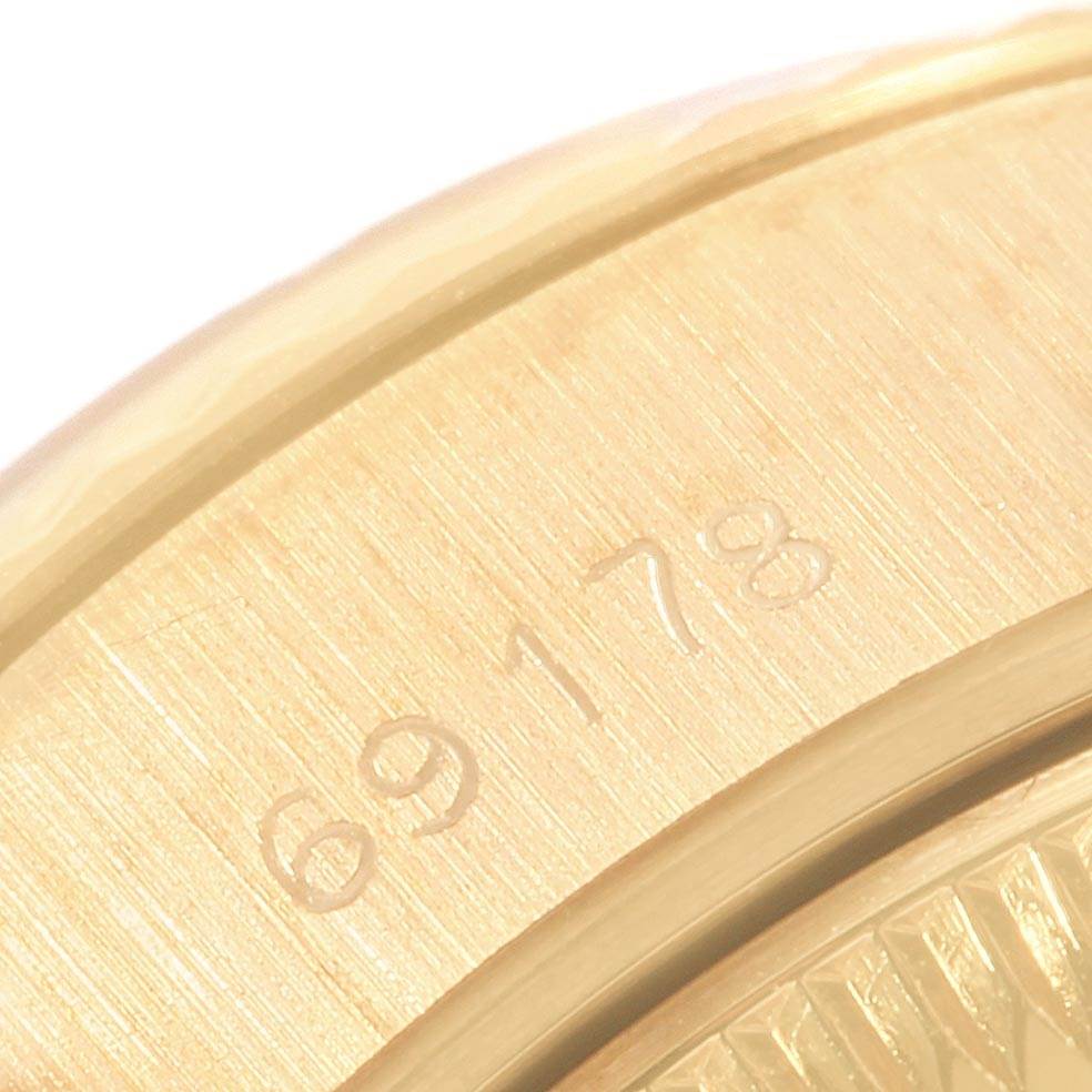 This close-up image shows the engraved case part of a Rolex President 69178 Women
s Yellow Gold Champagne Dial 69178 Women
s Yellow Gold Champagne Dial model watch.