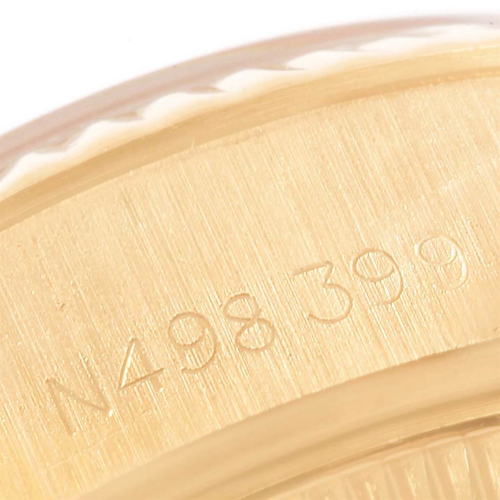 This is a close-up shot of the serial number engraved on the case back of the Rolex President 69178 Women's Yellow Gold Black Dial 69178 Women's Yellow Gold Black Dial model watch.
