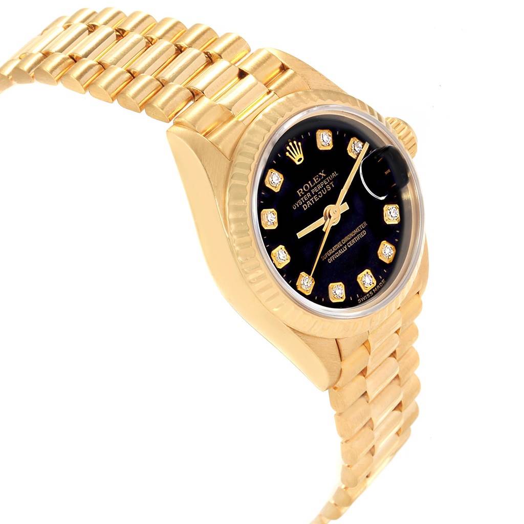 This image shows a side-angle view of a Rolex President 69178 Women's Yellow Gold Black Dial 69178 Women's Yellow Gold Black Dial model watch, highlighting its gold bracelet, case, and jeweled black dial.