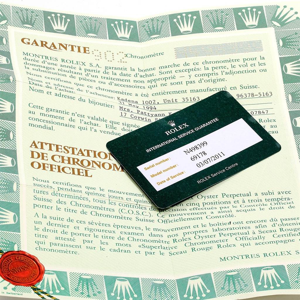 The image shows a Rolex President 69178 Women's Yellow Gold Black Dial 69178 Women's Yellow Gold Black Dial model warranty card and official chronometer certification.