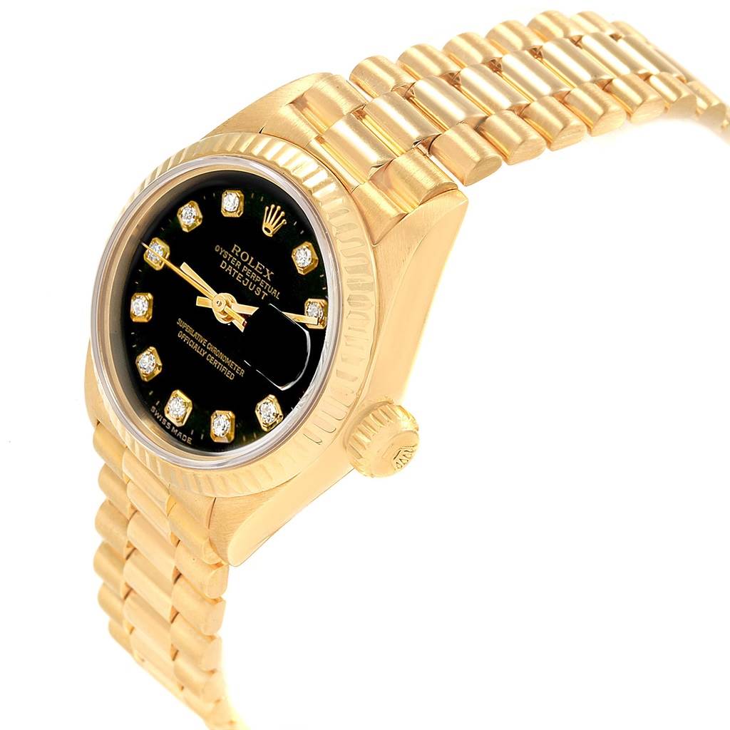 The image shows a side angle view of a Rolex President 69178 Women's Yellow Gold Black Dial 69178 Women's Yellow Gold Black Dial model watch, highlighting its black dial, gold case, crown, and bracelet.