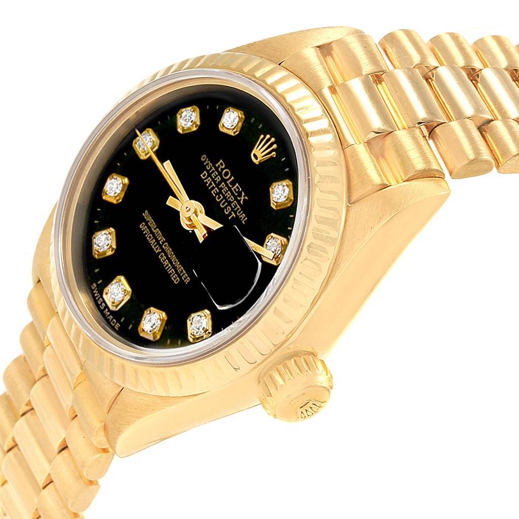 The image shows the dial, crown, and part of the bracelet of the Rolex President 69178 Women's Yellow Gold Black Dial 69178 Women's Yellow Gold Black Dial model watch from an angled side view.