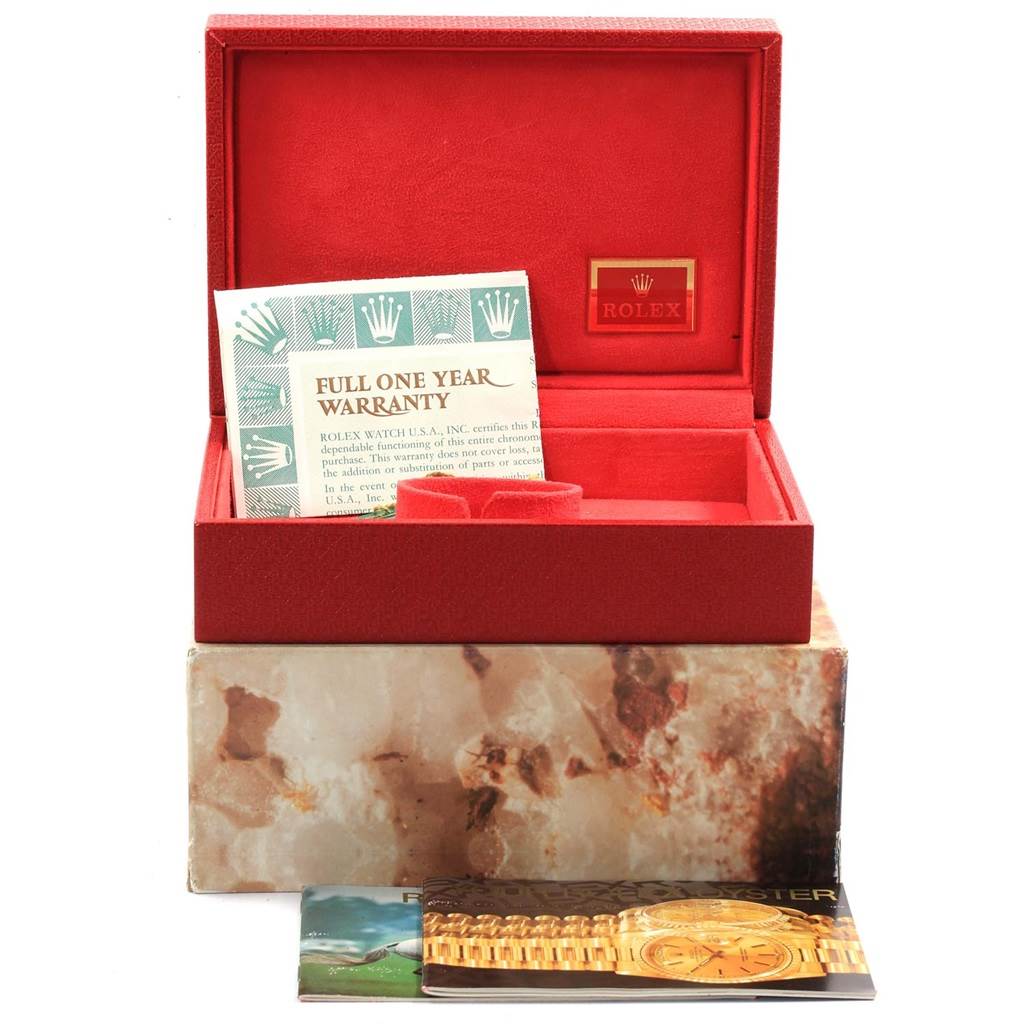 The image shows the open red box of a Rolex President 69258 Women's Yellow Gold Champagne Dial 69258 Women's Yellow Gold Champagne Dial watch along with warranty cards and user manuals.