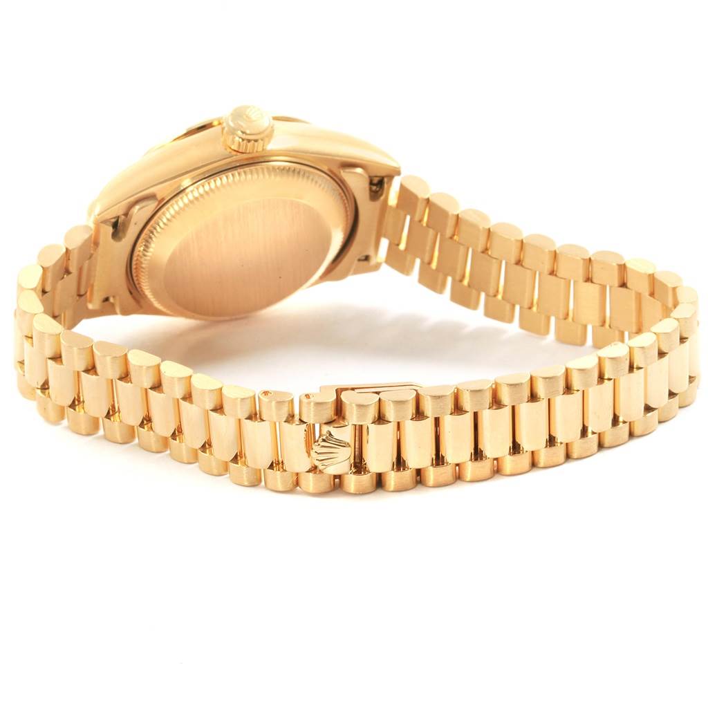 The image shows the back view of a Rolex President 69258 Women's Yellow Gold Champagne Dial 69258 Women's Yellow Gold Champagne Dial model watch, highlighting its gold case and bracelet.