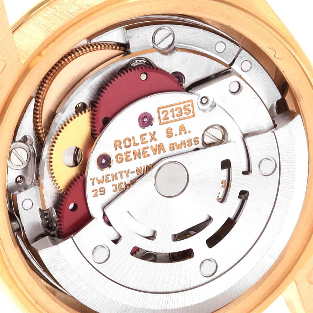 This image shows the internal movement mechanism of a Rolex President 69258 Women's Yellow Gold Champagne Dial 69258 Women's Yellow Gold Champagne Dial model watch, highlighting gears and inscriptions.