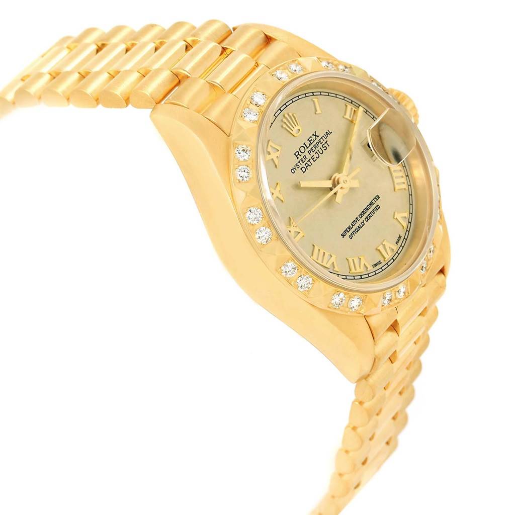 This is a side view of the Rolex President 69258 Women's Yellow Gold Champagne Dial 69258 Women's Yellow Gold Champagne Dial model, showing the dial, bezel, and part of the bracelet.