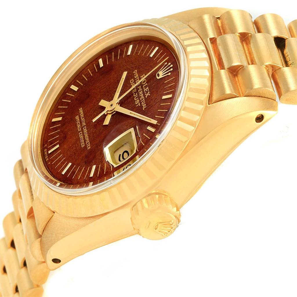 This image shows a side angle of the Rolex President 6917 Women's Yellow Gold Brown Dial 6917 Women's Yellow Gold Brown Dial model, highlighting its case, crown, dial, and part of the bracelet.