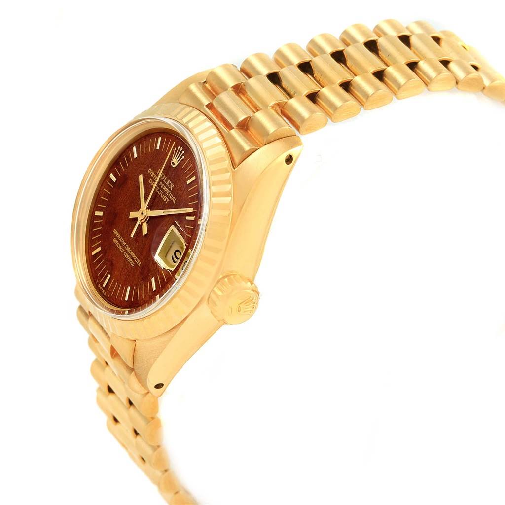 This image shows a side-angle view of a Rolex President 6917 Women's Yellow Gold Brown Dial 6917 Women's Yellow Gold Brown Dial model watch, highlighting the watch face, bezel, crown, and bracelet.