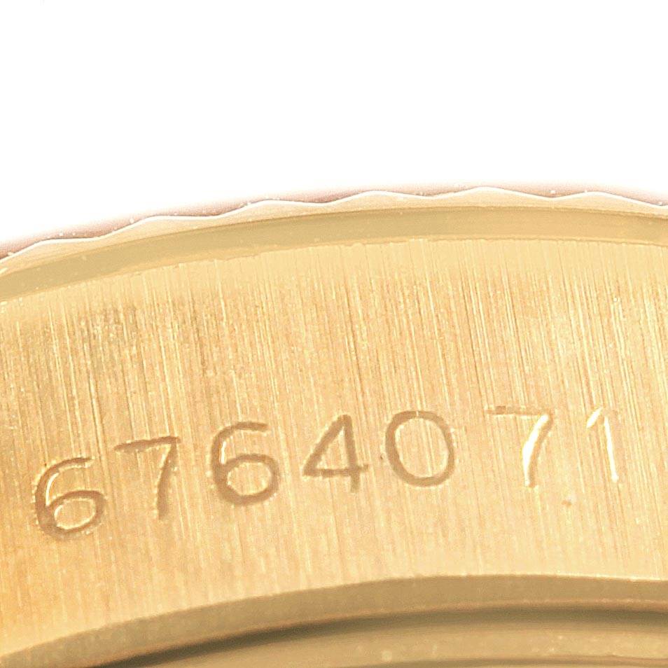 The image shows a close-up view of the serial number on the case back edge of a Rolex President 6917 Women's Yellow Gold Brown Dial 6917 Women's Yellow Gold Brown Dial model watch.